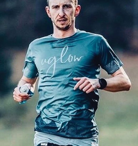 UGLOW · Own-brand race tee in the field